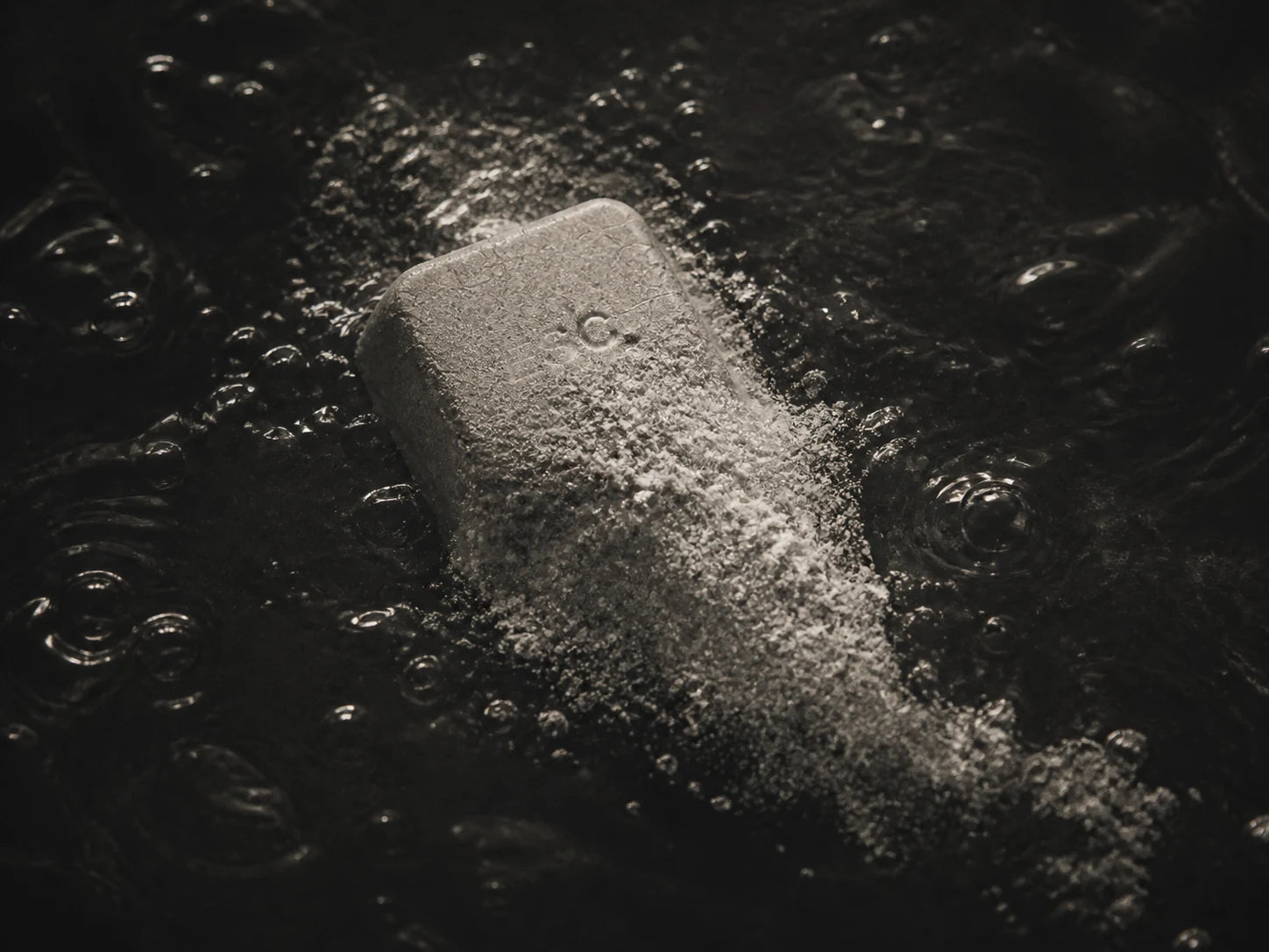 Concept visualization of the object’s edge dispersing into dark water.